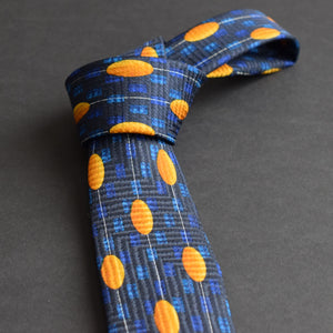 Blue necktie with yellow ovals