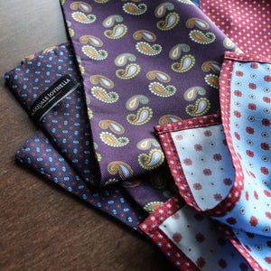 Two pocket squares laying on a table